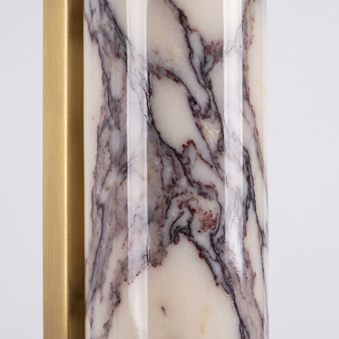 Close-up of the polished Calacatta Viola marble with fine purple-grey veining and brushed brass edge