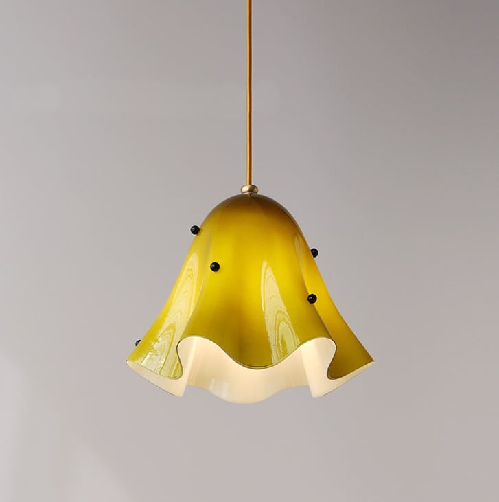 Draped Glass Pendant Light with a yellow glass shade and brass fitting
