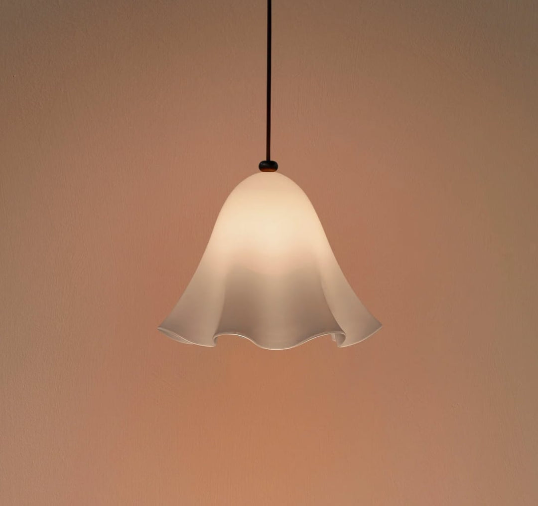 Opaline Draped Glass Pendant Light photographed against a warm peach backdrop