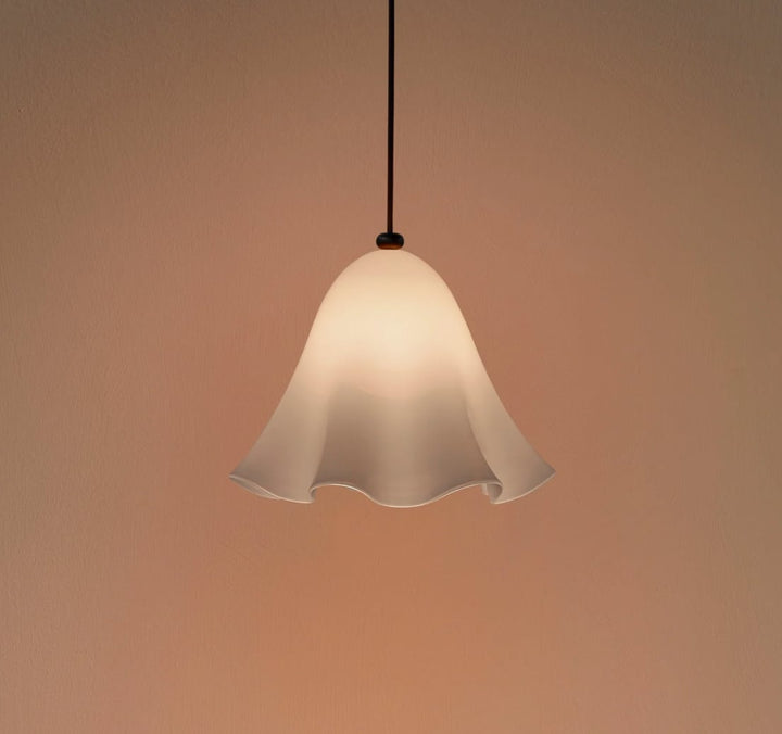 Opaline Draped Glass Pendant Light photographed against a warm peach backdrop
