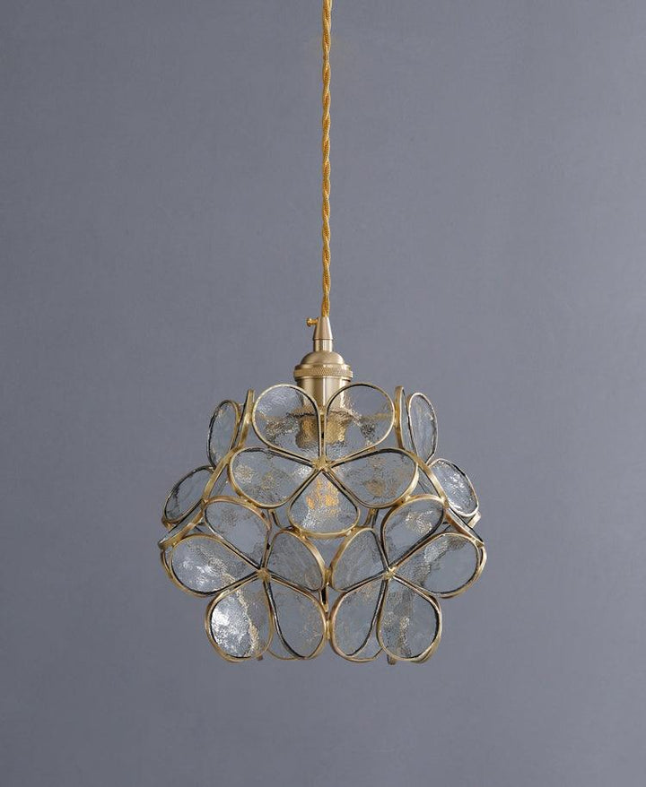 Glass Petal Pendant Light in transparent glass against a grey wall