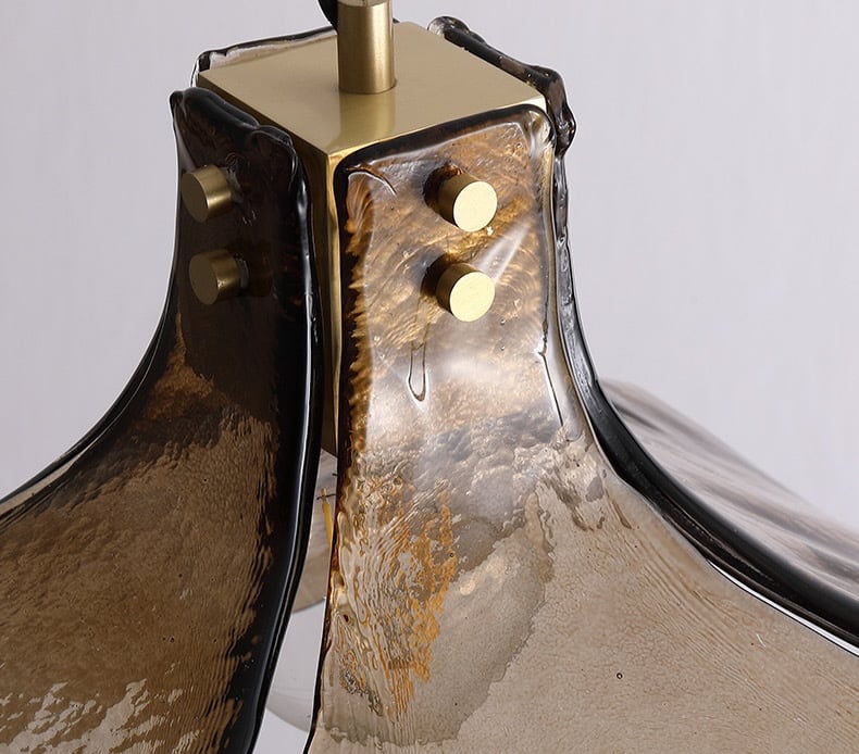 Detail of the brass fitting where the amber glass petals meet